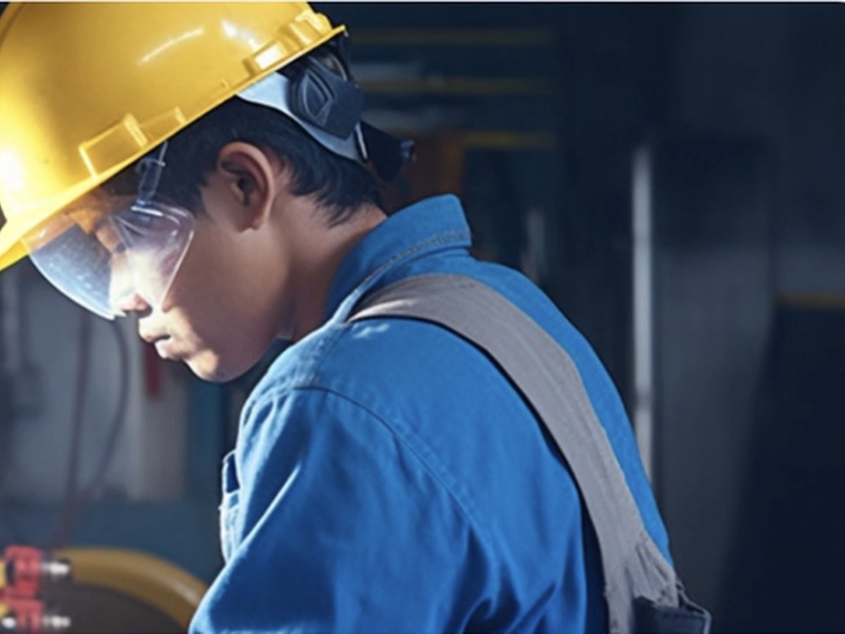Energy project specialist working on industrial infrastructure